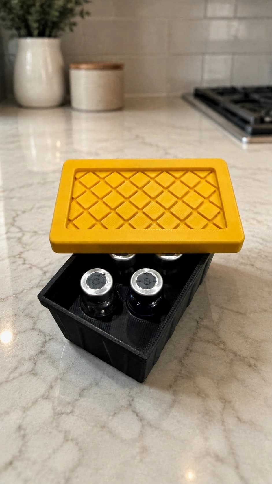 Black and yellow DailyPrintz tote case holding five vials
